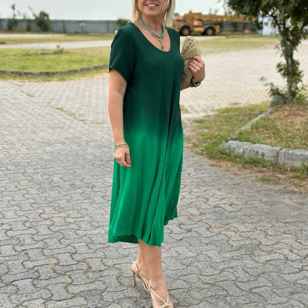 Valentina | Batik-inspireret kjole i bomuld med udskåret halsudskæring