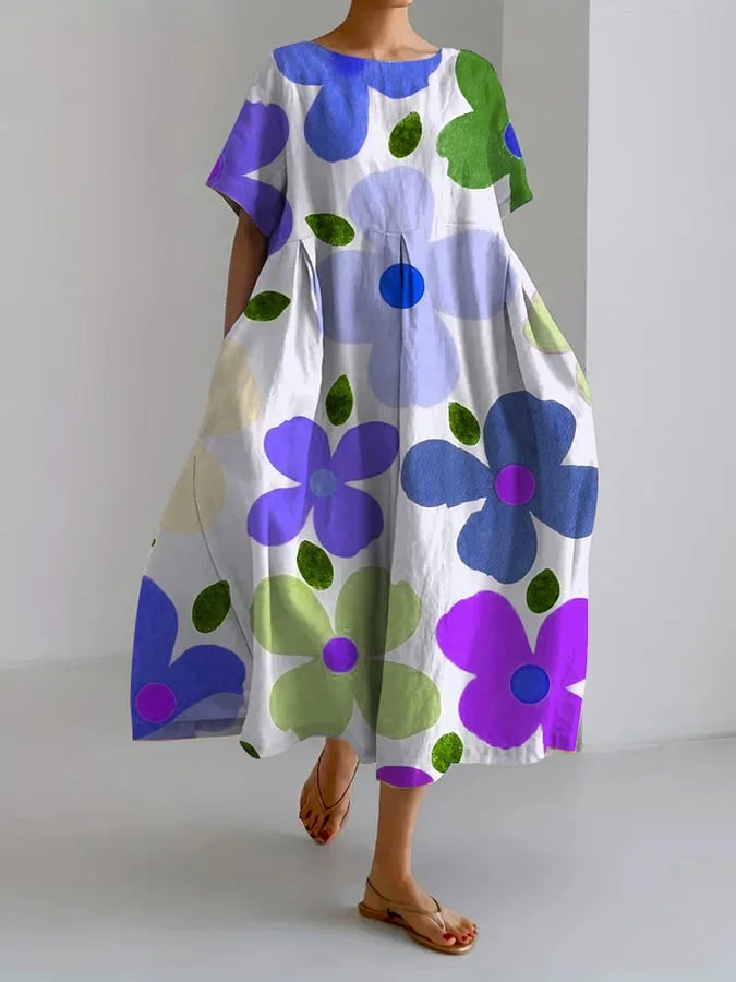 Inge | Blomstret midi-kjole med afslappet stil og sommerkomfort til farverige dage