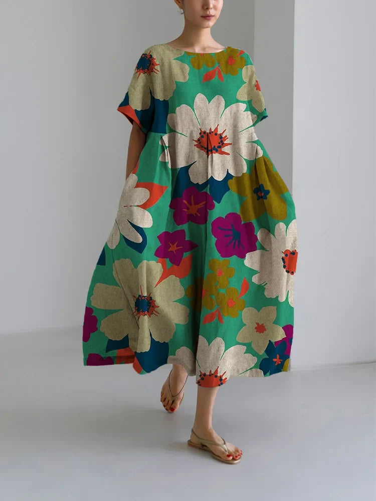 Selma | Blomstret midi-kjole med dristigt design og let komfort til livlige dage